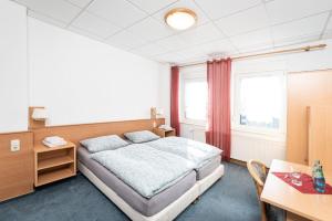 Ένα ή περισσότερα κρεβάτια σε δωμάτιο στο Pension Greiser