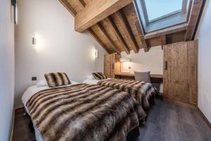 Ένα ή περισσότερα κρεβάτια σε δωμάτιο στο Chalet Saint Joseph