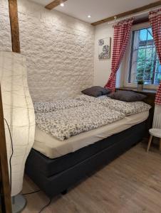 a bedroom with a bed in a room at Haus Schönek in Warmensteinach