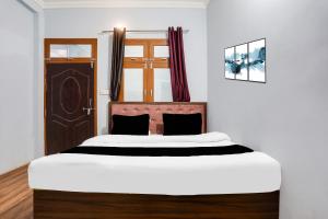 Ένα ή περισσότερα κρεβάτια σε δωμάτιο στο Hotel O Asian Highway