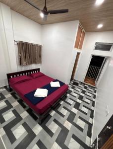 Postel nebo postele na pokoji v ubytování Adhvaya stay in