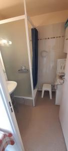 a small bathroom with a sink and a toilet at Apartment in Barbotan-les-Thermes in Cazaubon