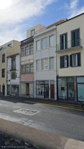 an empty city street with a building with windows at Lord Freitas in Funchal