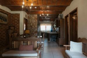 a living room with a couch and a table at Cabaña Real Victoria in Tepatitlán de Morelos