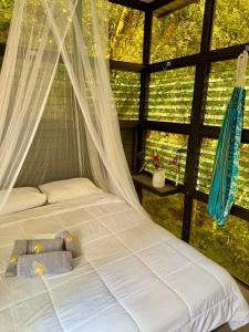 Postel nebo postele na pokoji v ubytování Jungle Loft + 2 fotografie