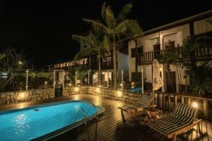 Bazén v ubytování Pousada Buena Onda - Garopaba-SC - 50m da Praia nebo v jeho okolí + 28 fotografií