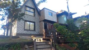 a house with stairs leading up to it at casa lila 2cuadras del mar in Mar Azul