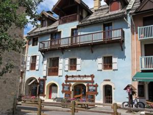 a blue building with balconies on the side of it at Charmant duplex 3 chambres, 8 personnes avec jardin, cheminée, proche pistes - Serre Chevalier - FR-1-762-32 in La Salle Les Alpes