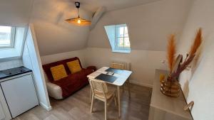 Kuchyň nebo kuchyňský kout v ubytování L'escale - charmant studio à Laval