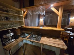 a kitchen with a sink and a counter at Penzion pod Špičákem in Tanvald +15 photos