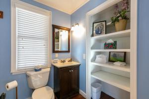 a bathroom with a toilet and a sink at A Parkway Cabin in Boone +40 photos
