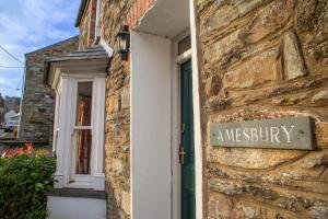 a sign on the side of a building at Amesbury Newport, Pembrokeshire in Newport Pembrokeshire