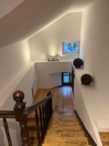 a staircase with a sink in a house at Boardwalk center in Mayrhofen +4 photos