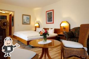 Ένα ή περισσότερα κρεβάτια σε δωμάτιο στο Pension Hubertushof