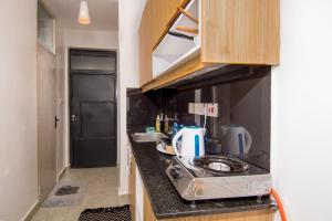 Η κουζίνα ή μικρή κουζίνα στο Royal suburbs by Tsavo