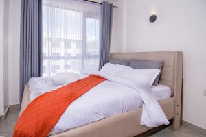 Ένα ή περισσότερα κρεβάτια σε δωμάτιο στο Royal suburbs by Tsavo