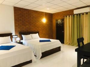 Ένα ή περισσότερα κρεβάτια σε δωμάτιο στο Discovery resort