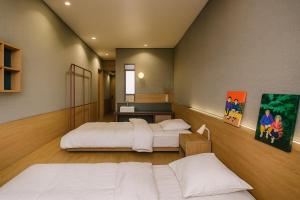 Postel nebo postele na pokoji v ubytování Stay Ohana