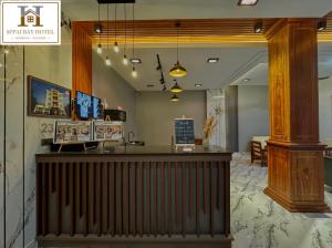 a restaurant with a reception desk and a lobby at M'pai Bay Hotel in Koh Rong Sanloem