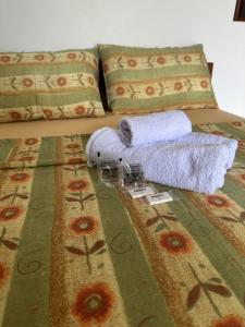 Ένα ή περισσότερα κρεβάτια σε δωμάτιο στο Pousada Solar de Anita Ferrugem