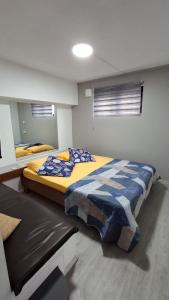 a bedroom with two beds in a room at Ti kaz Amater Cascavelle in Cascavelle