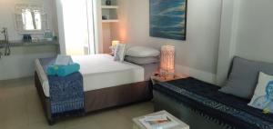 Ένα ή περισσότερα κρεβάτια σε δωμάτιο στο the Oasis