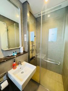 a bathroom with a sink and a shower at Lucentia Residence by Infinity swimming pool,lalaport KL in Kuala Lumpur