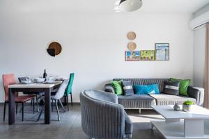 a living room with a couch and a table at Sonic 2-Bedroom Apartment in Larnaca