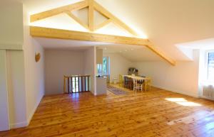 an open living room with aamed ceilings and wooden floors at Gite NAYA in Saint-Christophe-sur-Dolaison +43 photos