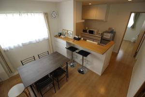 Η κουζίνα ή μικρή κουζίνα στο Guesthouse徳島201 +21 φωτογραφίες