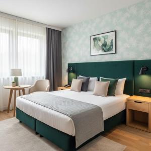 Ένα ή περισσότερα κρεβάτια σε δωμάτιο στο Boulevard Side Hotel