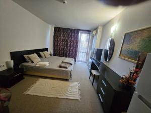 a small room with a bed and a window at Студио за двама в Сарафово in Burgas City +7 photos
