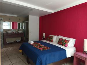 Ένα ή περισσότερα κρεβάτια σε δωμάτιο στο Hotel Boutique Acocalli