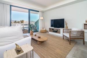 Et tv og/eller underholdning på INF24E - Modern 2-Bed Apt with roof top pool