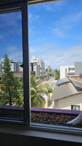 a view of a city from a window at Refúgio próximo ao mar in Cabedelo