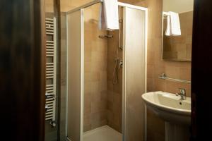 a bathroom with a shower and a sink at Hotel Chalet Seggiovia in Pontechianale +33 photos