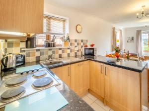 Kuchyň nebo kuchyňský kout v ubytování Fair Isle Holiday Cottages - Hill Top Cottage