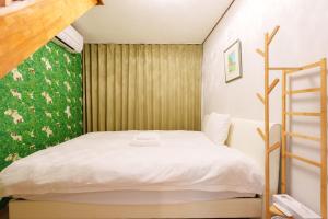 Ένα ή περισσότερα κρεβάτια σε δωμάτιο στο Dotonbori Villa 5 bedrooms, 1 living room, 3 bathrooms