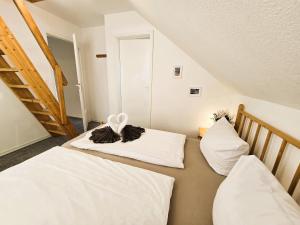 Postel nebo postele na pokoji v ubytování Ferienhaus Hagebutte