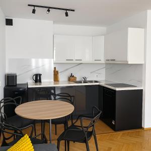 Kuchyň nebo kuchyňský kout v ubytování Apartment Just Around the Corner