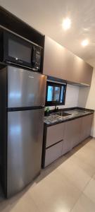 Η κουζίνα ή μικρή κουζίνα στο Departamentos Premium +22 φωτογραφίες