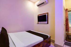 Ένα ή περισσότερα κρεβάτια σε δωμάτιο στο Hotel O Vedika Acropolis Mall +21 φωτογραφίες