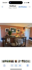 a screenshot of a room with a table in a room at The Copper Swan in Wellfleet