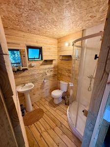 a small bathroom with a toilet and a shower at Glamping Puertecillo Surf & Camp in Puertecillo +151 photos
