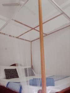 Ένα ή περισσότερα κρεβάτια σε δωμάτιο στο LC&S Homestay Mirssa