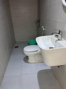 a bathroom with a white toilet and a sink at نزل الاوئل in Al Madinah +12 photos