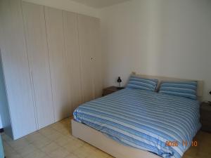 Ένα ή περισσότερα κρεβάτια σε δωμάτιο στο Il Posto Giusto