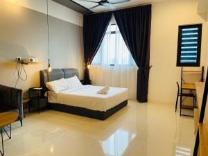 Ένα ή περισσότερα κρεβάτια σε δωμάτιο στο Kuala Lumpur At Chamber +57 φωτογραφίες