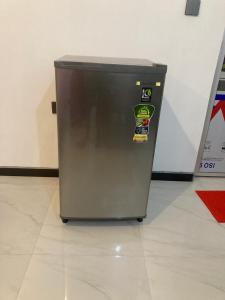 a refrigerator with stickers on the side of it at Pabalu House in Ahangama