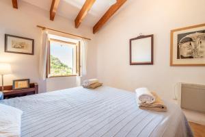 Ένα ή περισσότερα κρεβάτια σε δωμάτιο στο Little Paradise in Banyalbufar